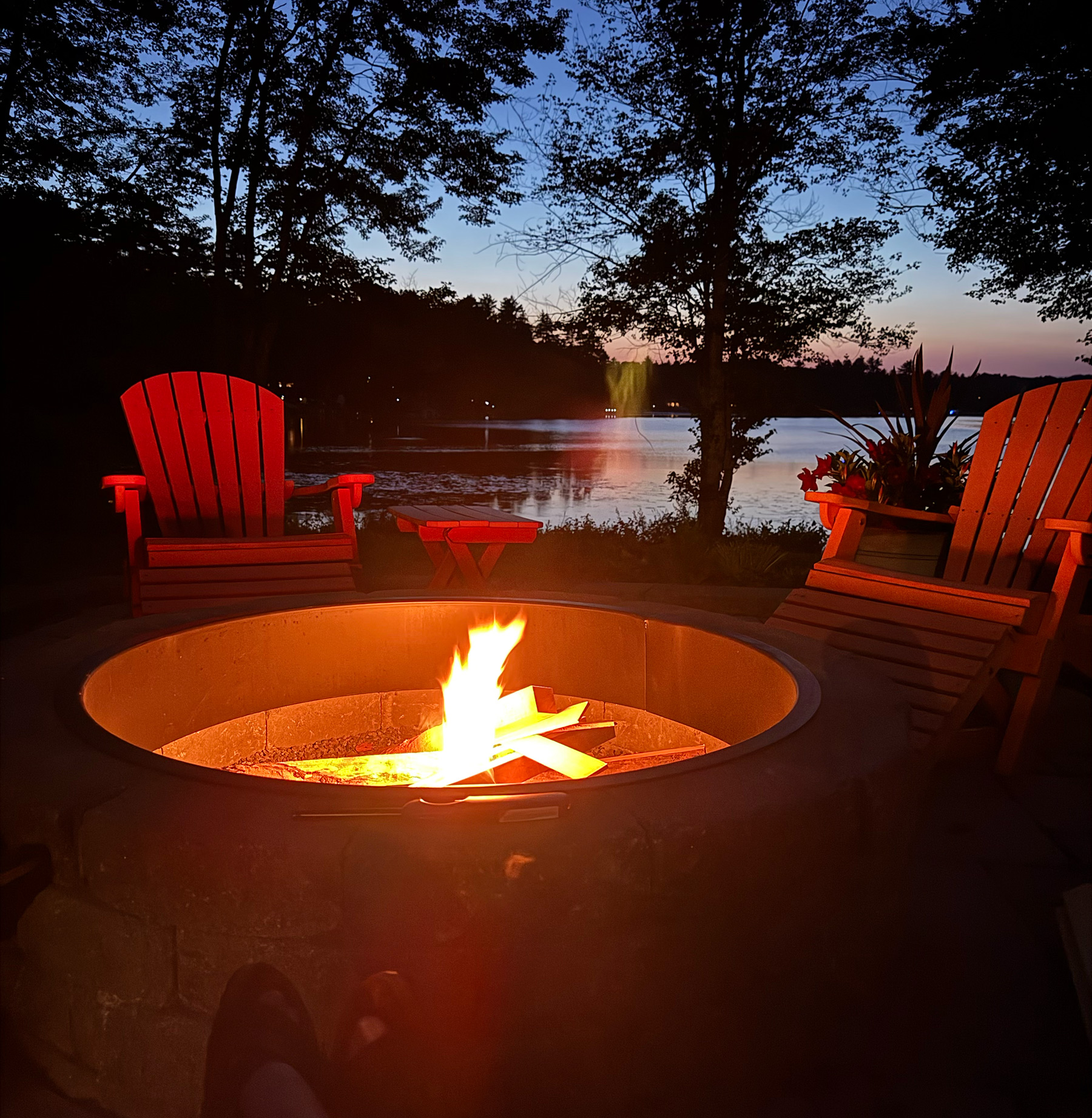 Fire pit at night — Harmony House, Harvey Lake NH
